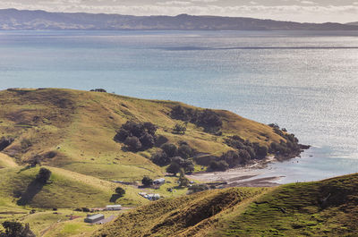 High angle view of land and sea against sky