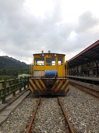 Train on railroad track against sky