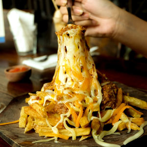 Close-up of person preparing food on table