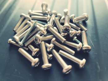 Close-up of screws on table