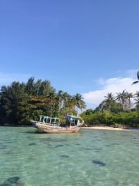 Boat in sea against sky