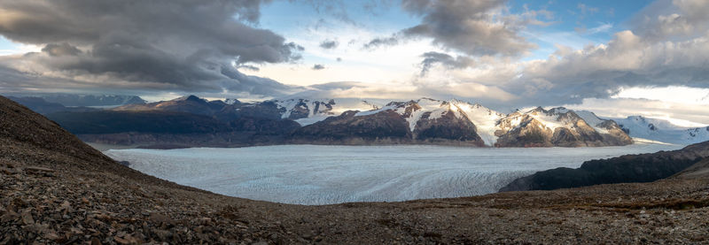 Panoramic view of snowcapped mountains against sky