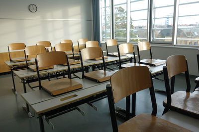 Empty chairs and table in cafe