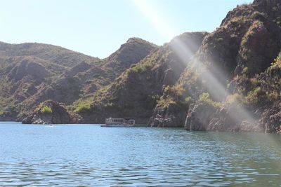 Scenic view of waterfall against sky