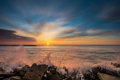 Scenic view of sea against sky during sunset