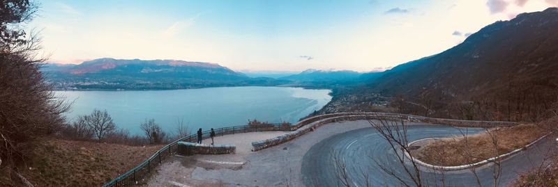 Panoramic view of dam and mountains against sky