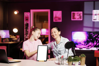 Businesswoman using laptop at table