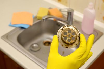 Close-up of yellow machine on table