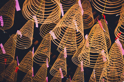 Close-up of illuminated decoration hanging against black background