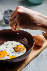 Midsection of person having breakfast