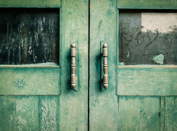 Close-up of old wooden door of building