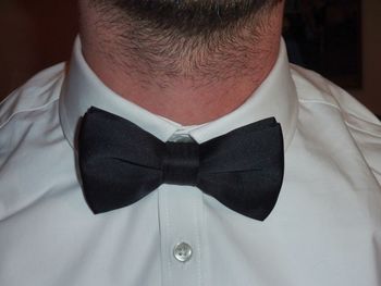 Close-up of man wearing bow tie