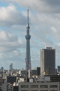 Skytree tower dominating tokyo skyline. futuristic architecture in modern urban cityscape