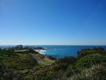 Scenic view of sea against clear blue sky