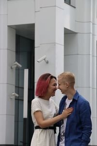 Young couple looking at building