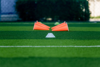 Close-up of umbrella on soccer field