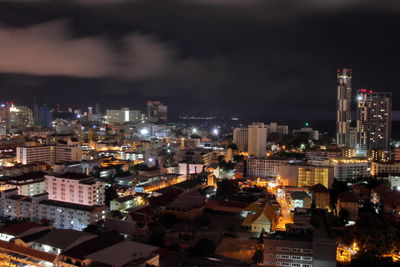 High angle view of illuminated city buildings at night