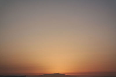 Scenic view of silhouette mountain against sky during sunset