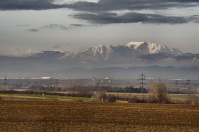 Scenic view of farm against sky