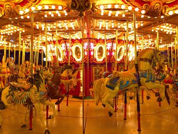 Illuminated carousel at amusement park