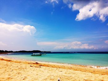 Scenic view of sea against cloudy sky