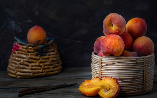 Close-up of apples in basket on table