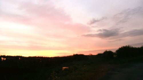 Scenic view of landscape at sunset