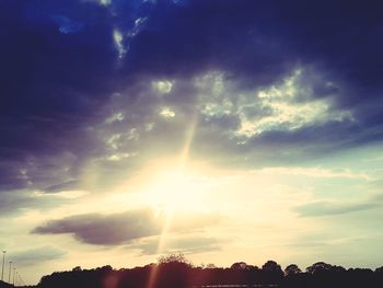 Low angle view of silhouette trees against sky during sunset