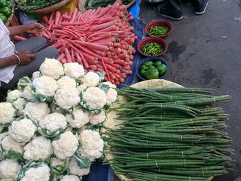 High angle view of man selling vegetables at market