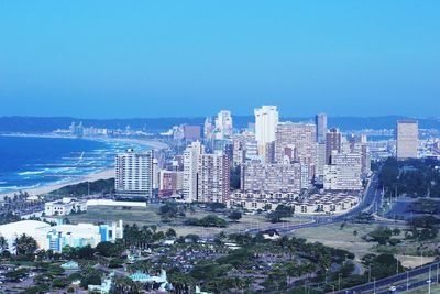 View of cityscape against blue sky