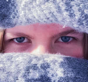 Close-up portrait of man in snow