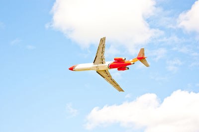 Low angle view of airplane flying in sky