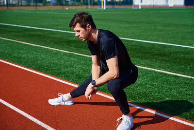Sport man preparing for jogging outdoors