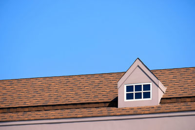 Low angle view of building against blue sky