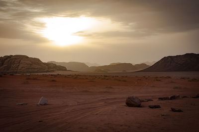 Scenic view of desert landscape against sky during sunset