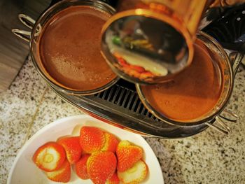 High angle view of fruits in plate on table