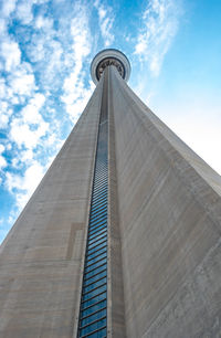 Low angle view of building against cloudy sky