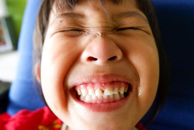 Close-up portrait of smiling girl 