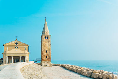 Cathedral by sea against sky