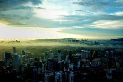 High angle view of city at sunset