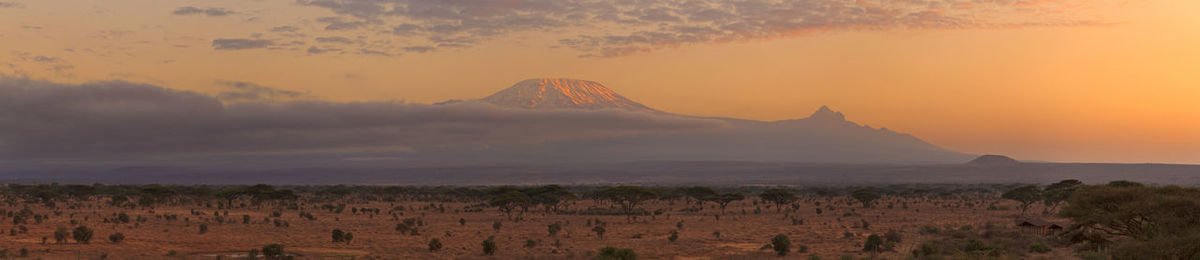 Scenic view of landscape against sky during sunset