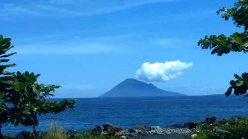 Scenic view of sea against cloudy sky