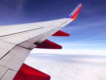 Low angle view of airplane flying in sky