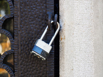 Close-up of padlock on metallic gate