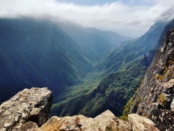 Aerial view of valley and mountains against sky