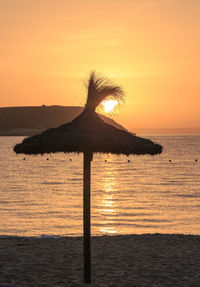 Scenic view of sea against sky at sunset