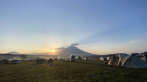 Scenic view of landscape against sky during sunrise