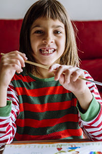 Portrait of smiling girl holding ice cream