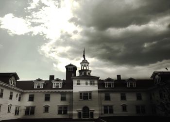 High section of building against cloudy sky