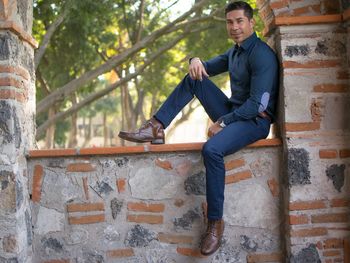 Man sitting in front of building